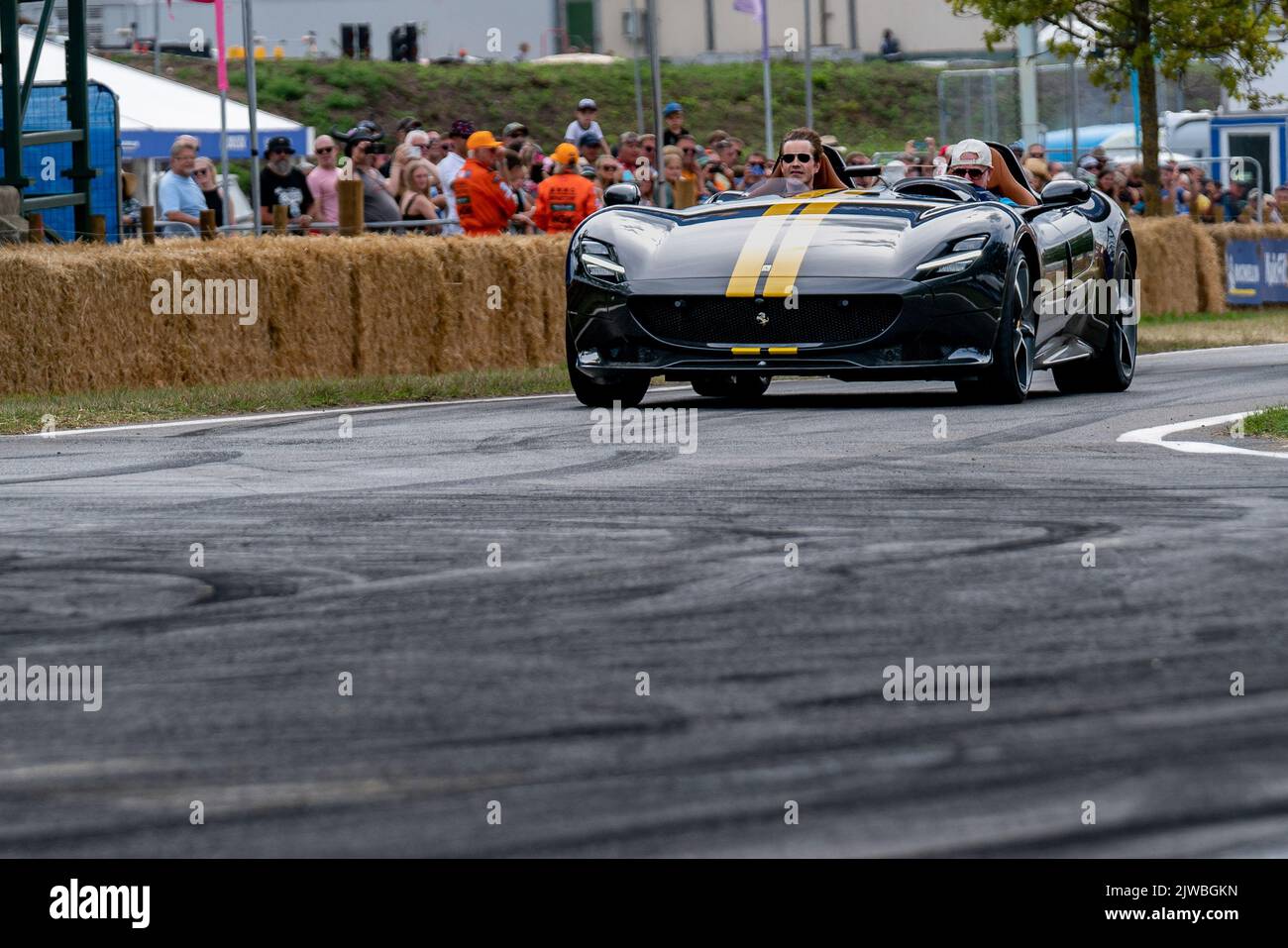 Jimmy Carr and Chris Evans Take a ride round the track at the Car fest
