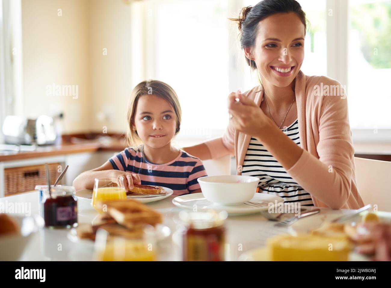 Great days begin with family breakfasts. a family having breakfast together. Stock Photo