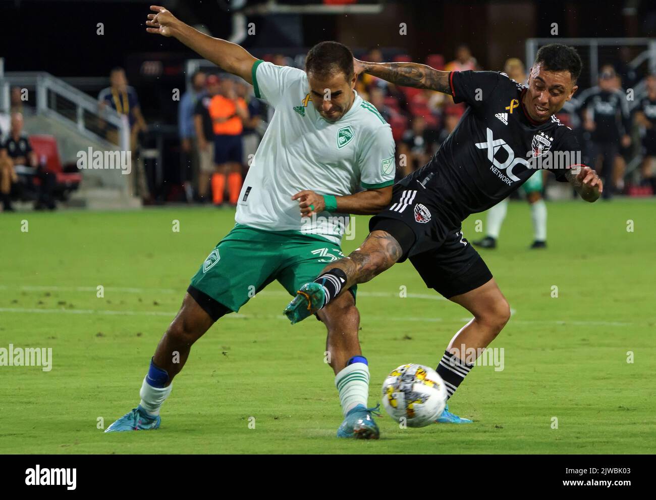 WASHINGTON, DC, USA - 4 SEPTEMBER 2022: D.C. United forward Martin Rodriguez (77) and Colorado Rapids defender Steven Beitashour (33) battle for the ball during a MLS match between D.C United and the Colorado Rapids, on September 04, 2022, at Audi Field, in Washington, DC. (Photo by Tony Quinn-Alamy Live News) Stock Photo