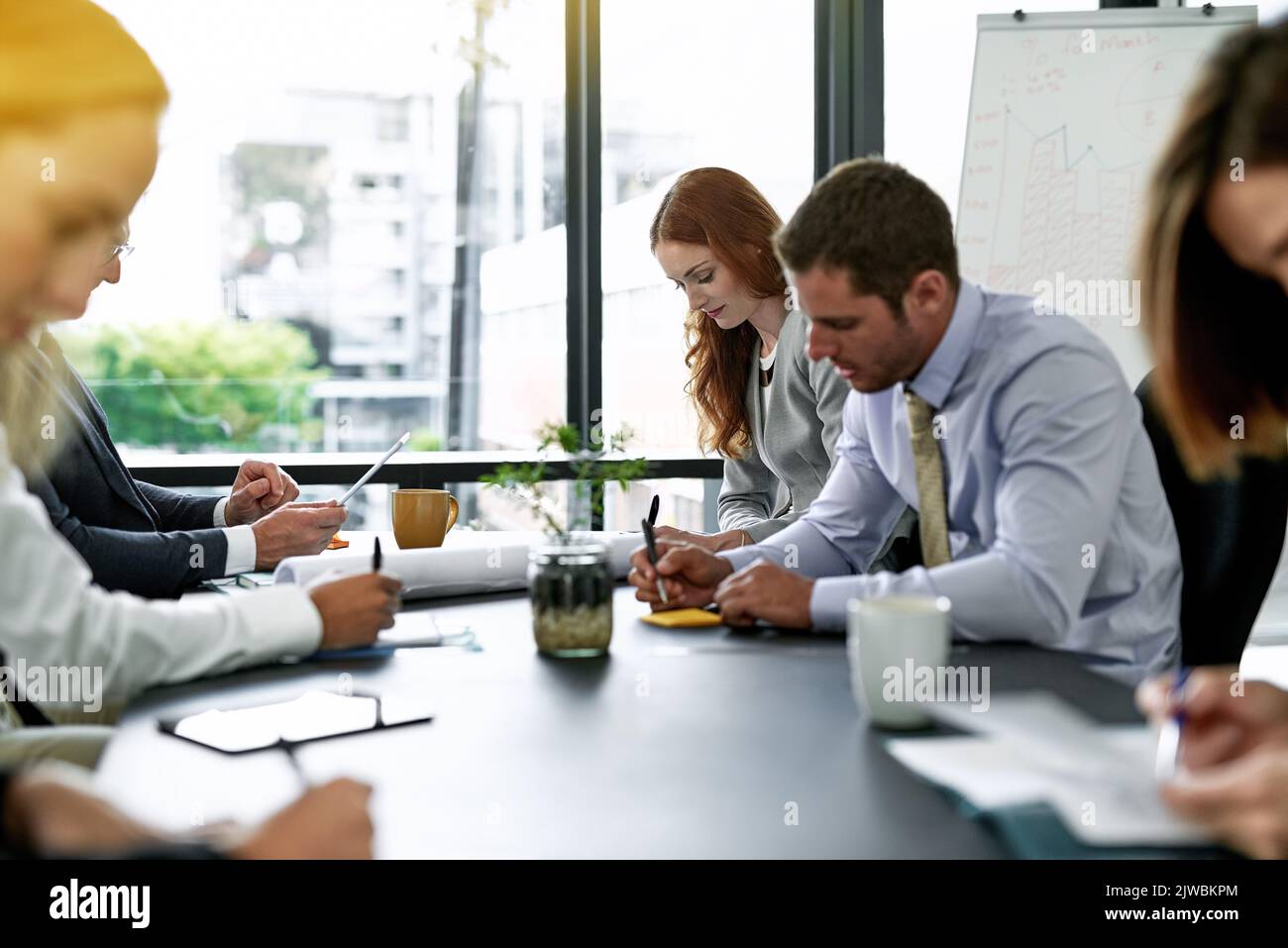 Theyve come to their meeting well prepared. a team of executives having a formal meeting in a boardroom. Stock Photo