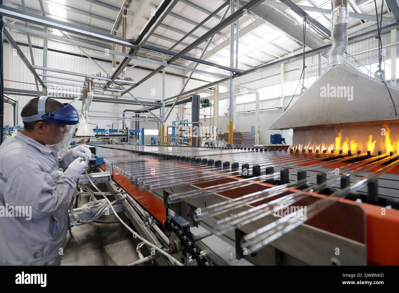 ZIXING, CHINA - AUGUST 29, 2022 - A worker works on the production line ...