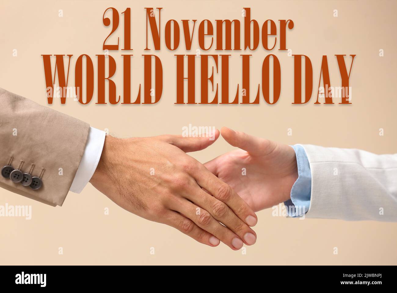 Business partners shaking hands on beige background. World Hello Day ...