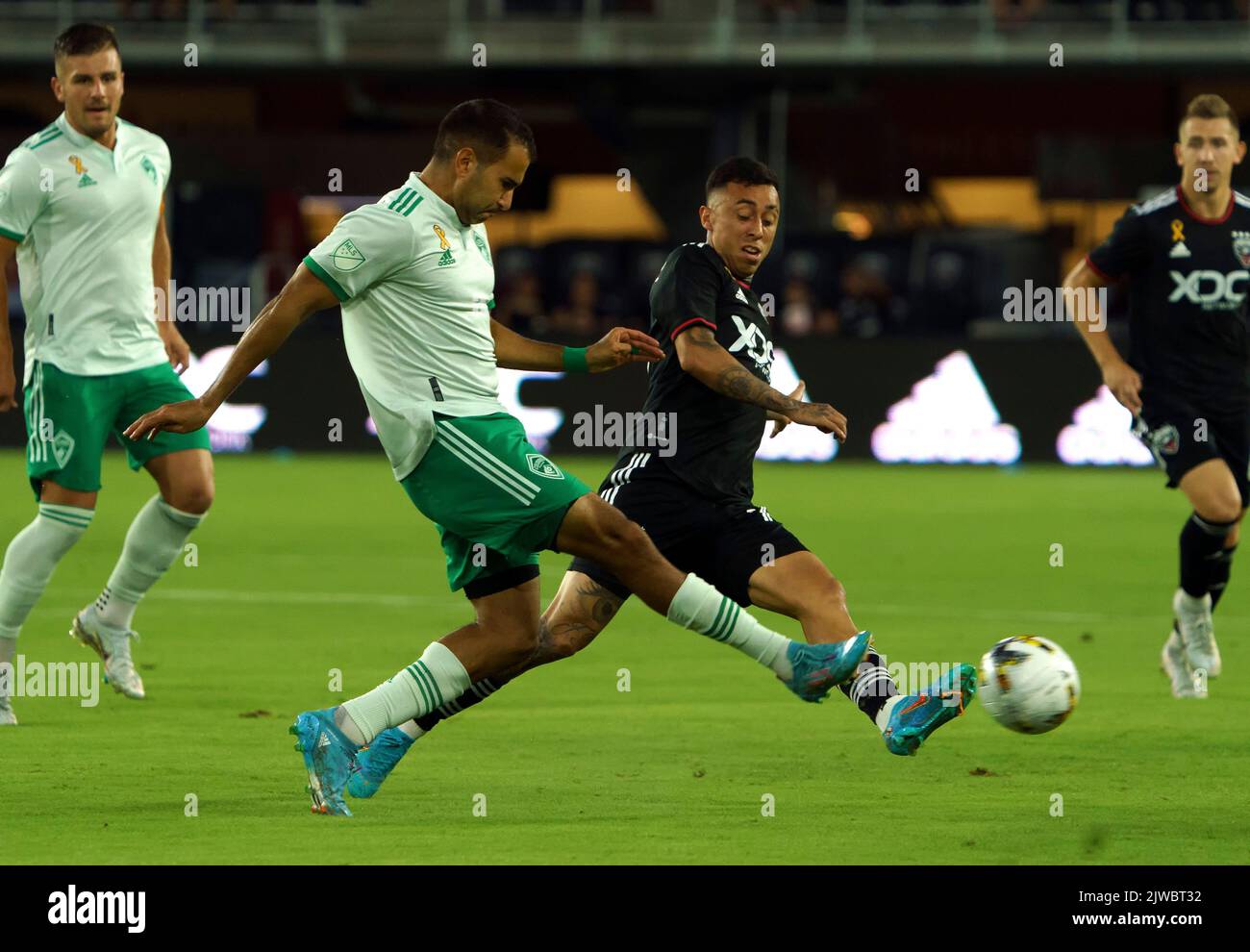 WASHINGTON, DC, USA - 4 SEPTEMBER 2022: during a MLS match between D.C United and the D.C. United forward Martin Rodriguez (77) sends a pass away from Colorado Rapids defender Steven Beitashour (33) Colorado Rapids, on September 04, 2022, at Audi Field, in Washington, DC. (Photo by Tony Quinn-Alamy Live News) Stock Photo