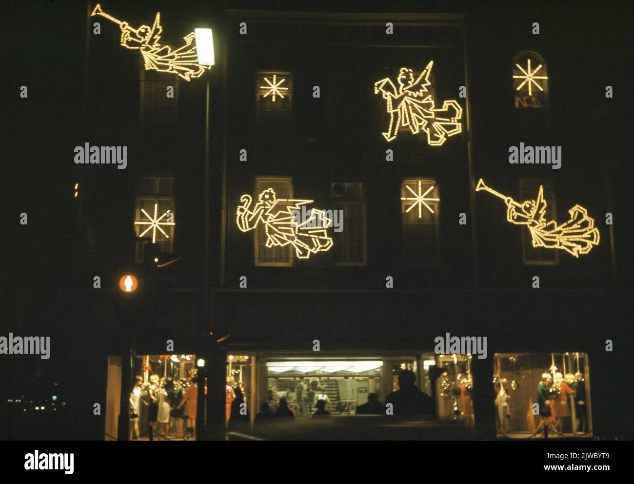 Image of the neon lighting on the facade of the building of clothing