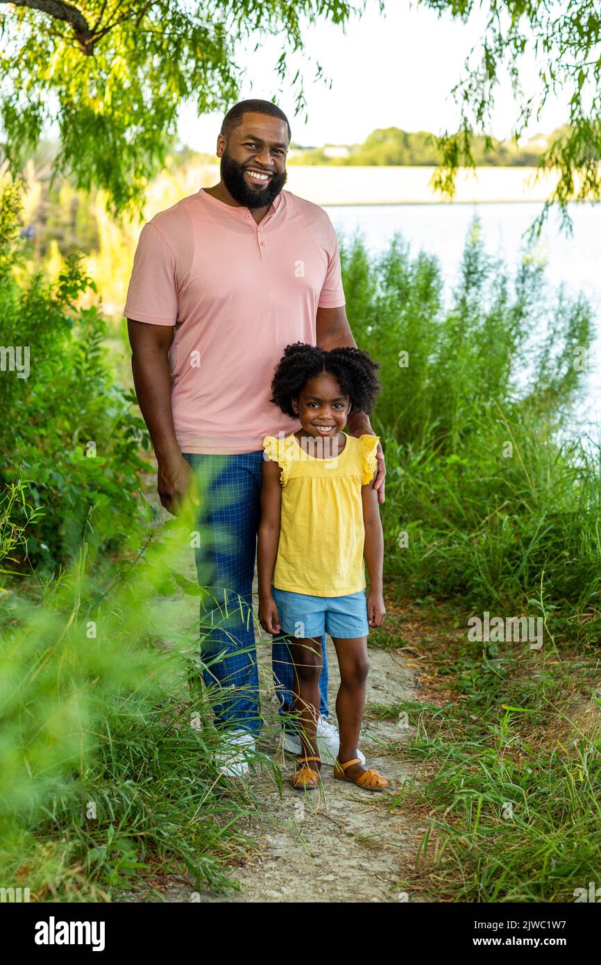 Happy father and his beautiful daughter smiling. Stock Photo