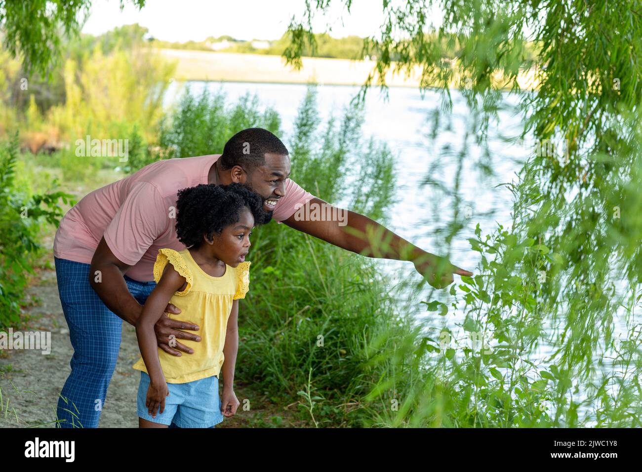 Happy father and his beautiful daughter smiling. Stock Photo