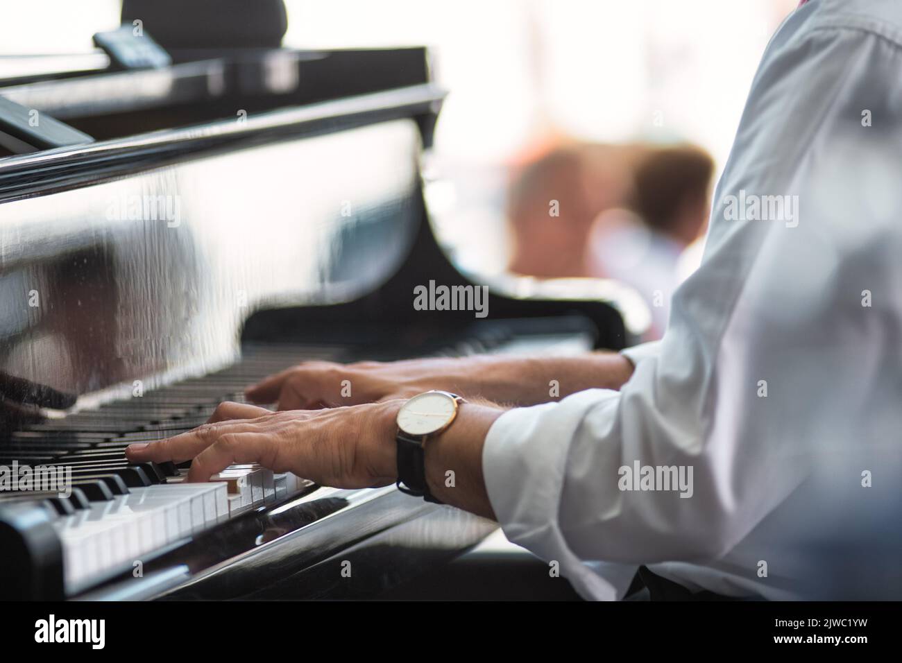 Detachment of a pianist's hands on the keyboard during a performance Stock Photo