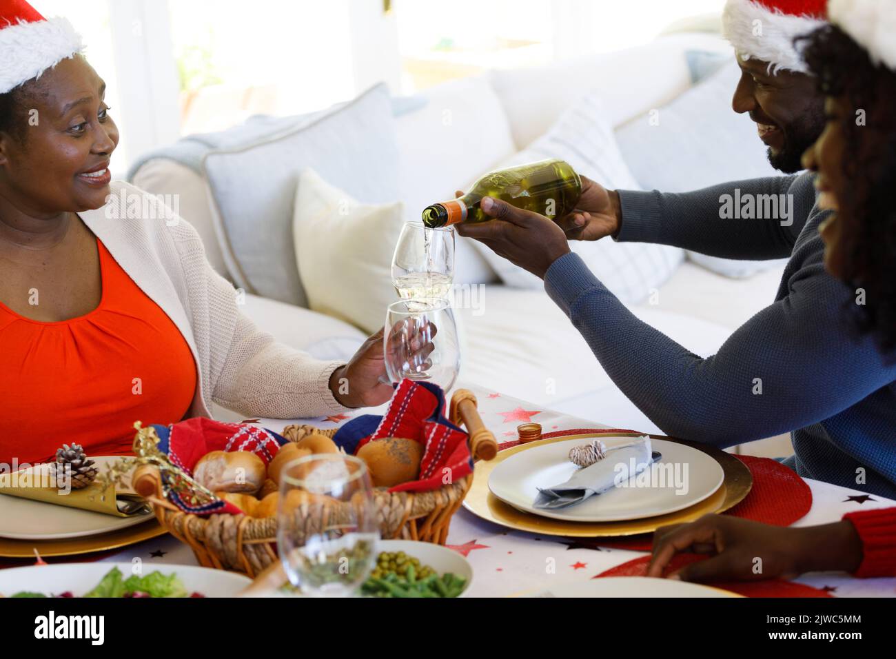 African american man pouring wine Stock Photo - Alamy