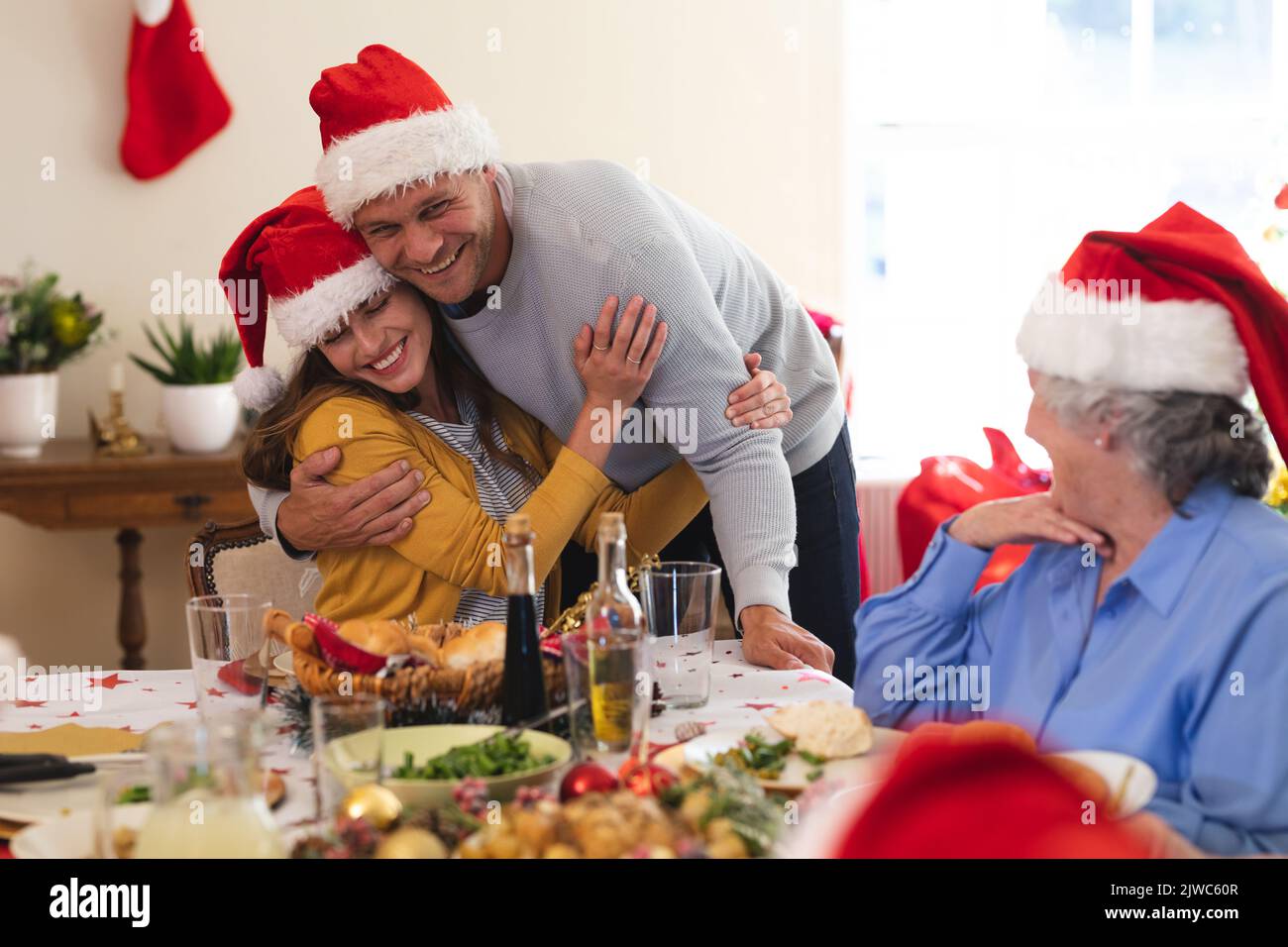 Caucasian couple sitting at table for dinner together Stock Photo
