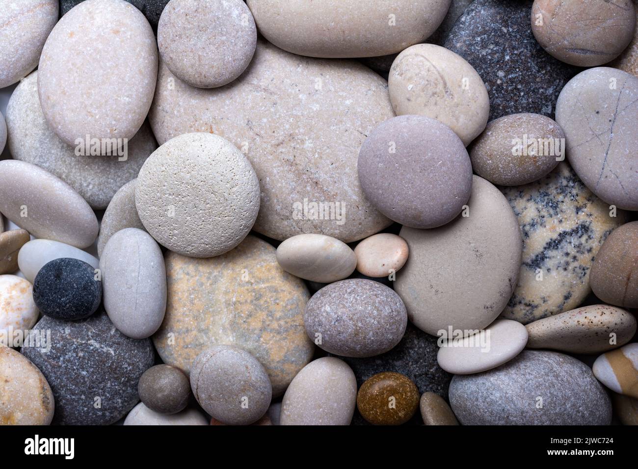 Background or banner with different size grey stones Stock Photo