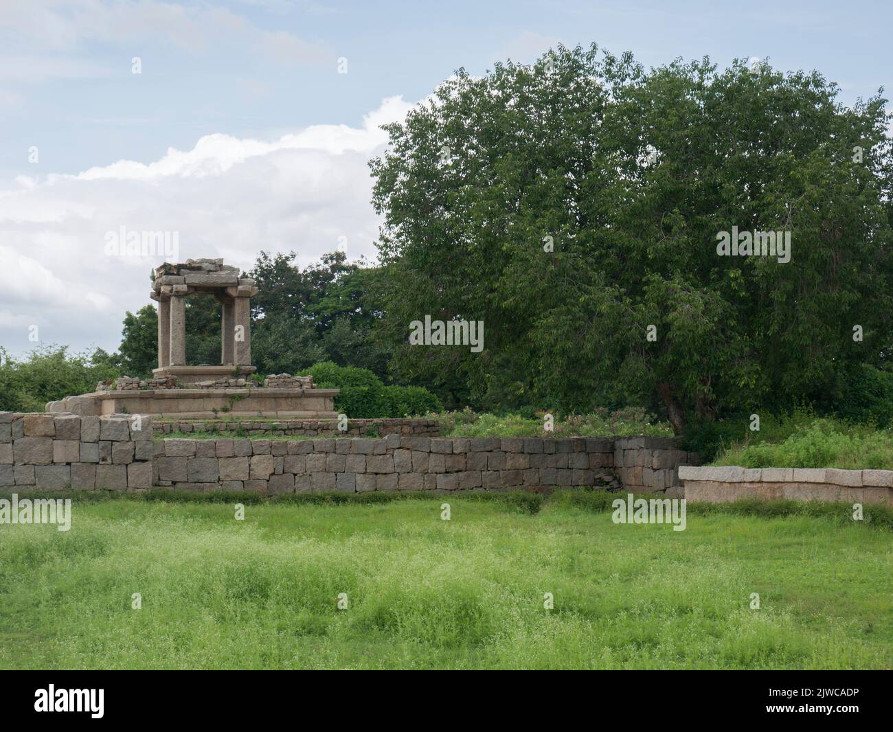 Water pool for public bath and sports near a stepped square water tank
