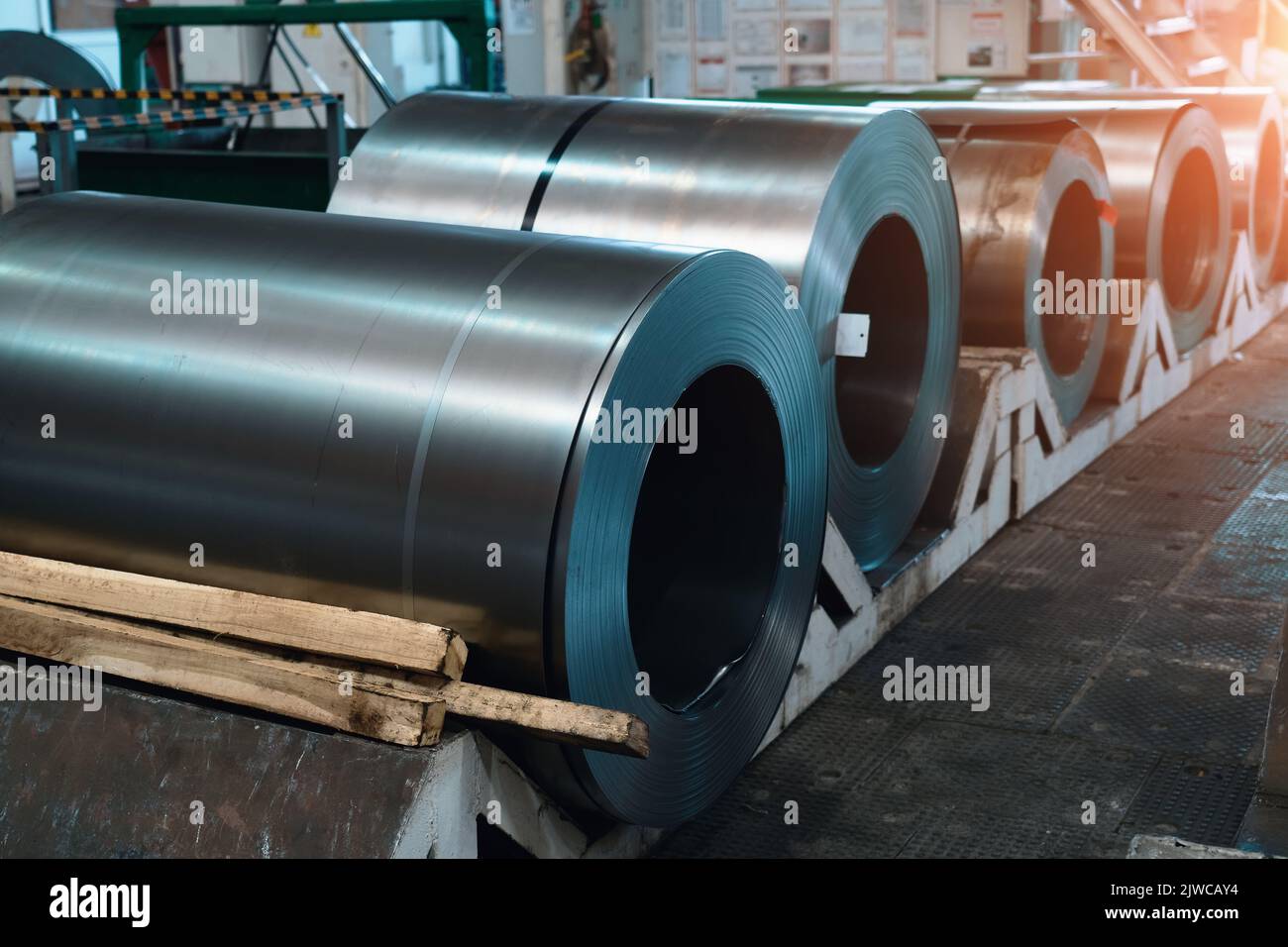 Rolls of steel sheets. Metal coils in metalwork factory Stock