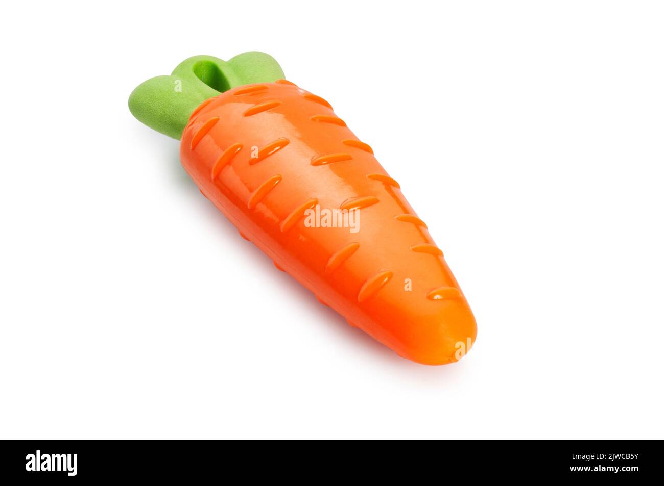 Studio shot of a carrot shaped dogs toy cut out against a white background - John Gollop Stock Photo