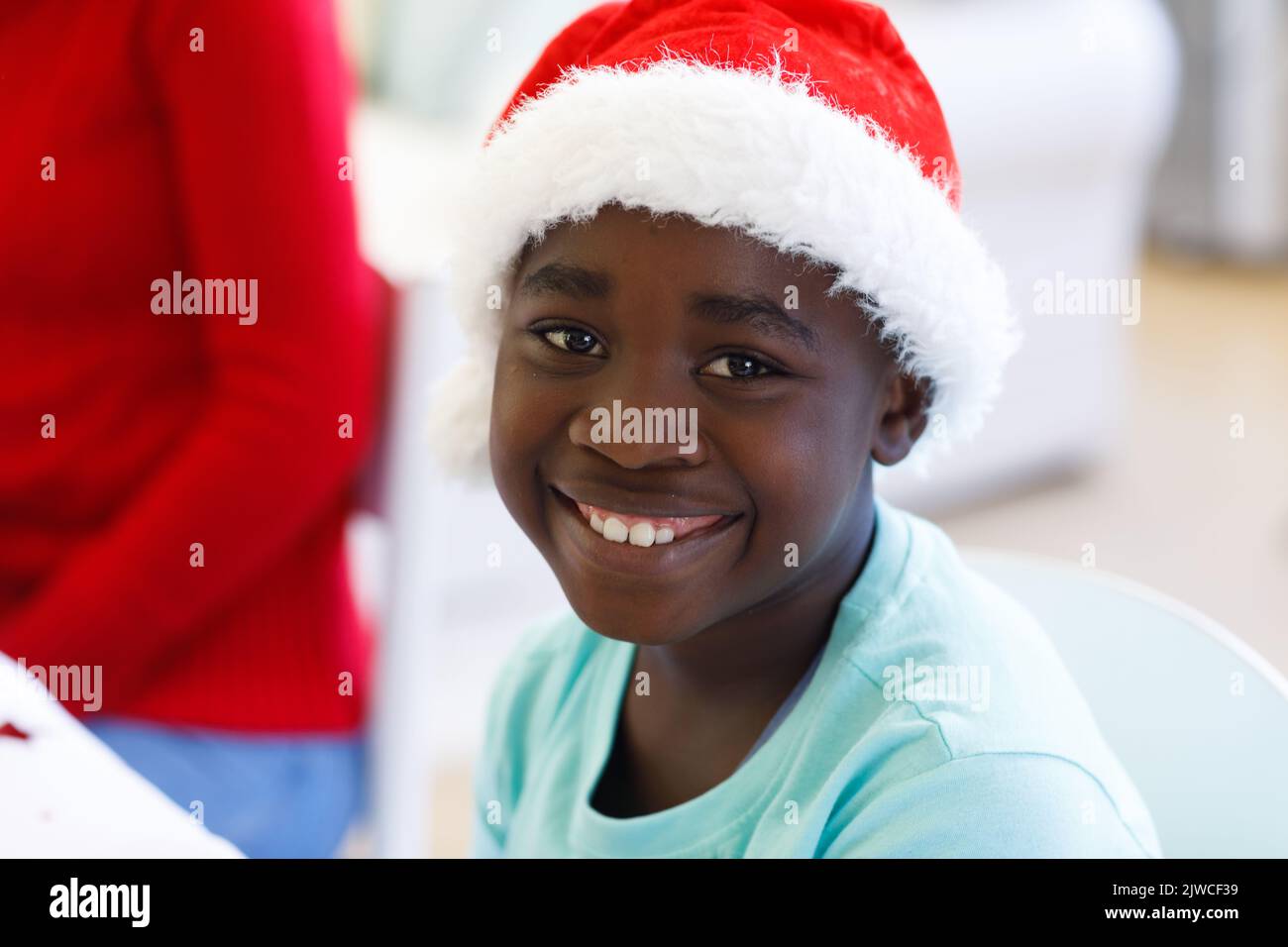 Portrait of african american boy wearing santa hat Stock Photo