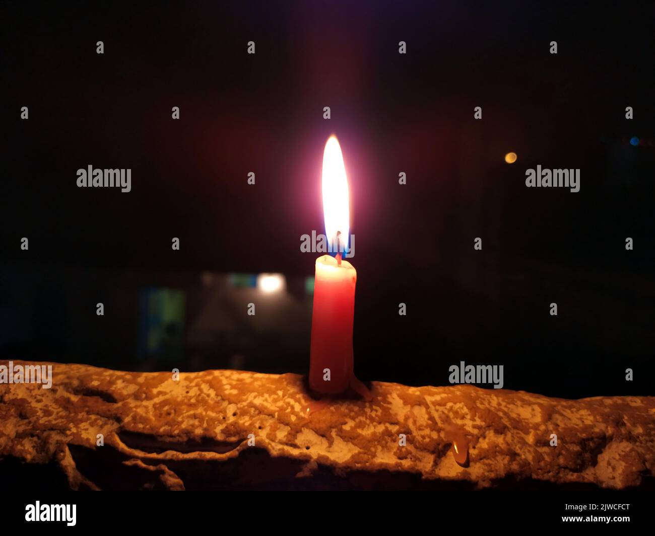 a candal flame is lightning in very dark night Stock Photo