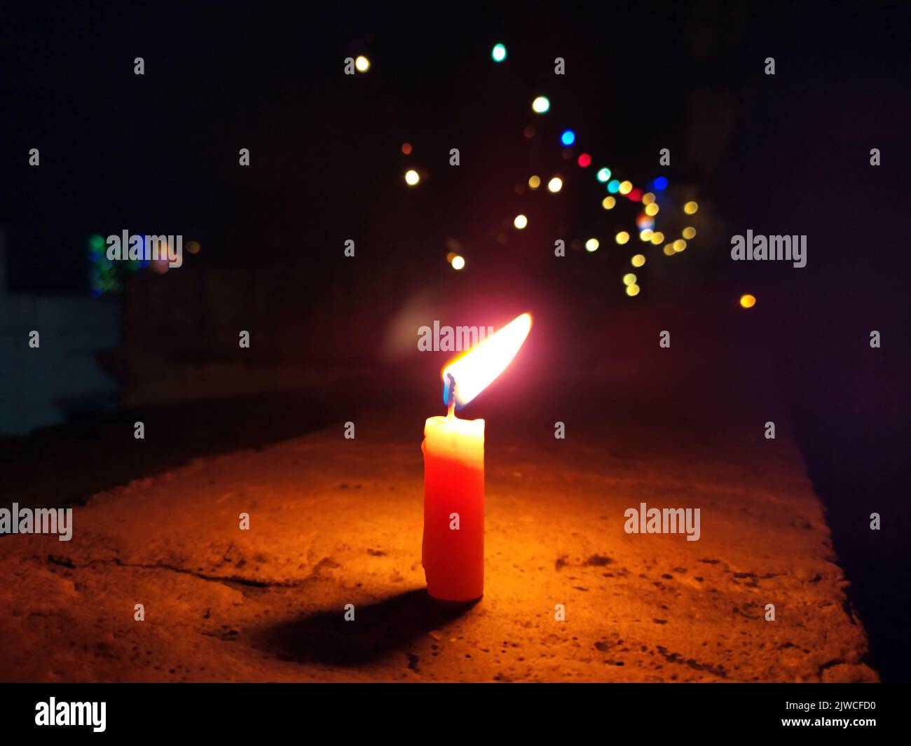 a candal flame is lightning in very dark night Stock Photo