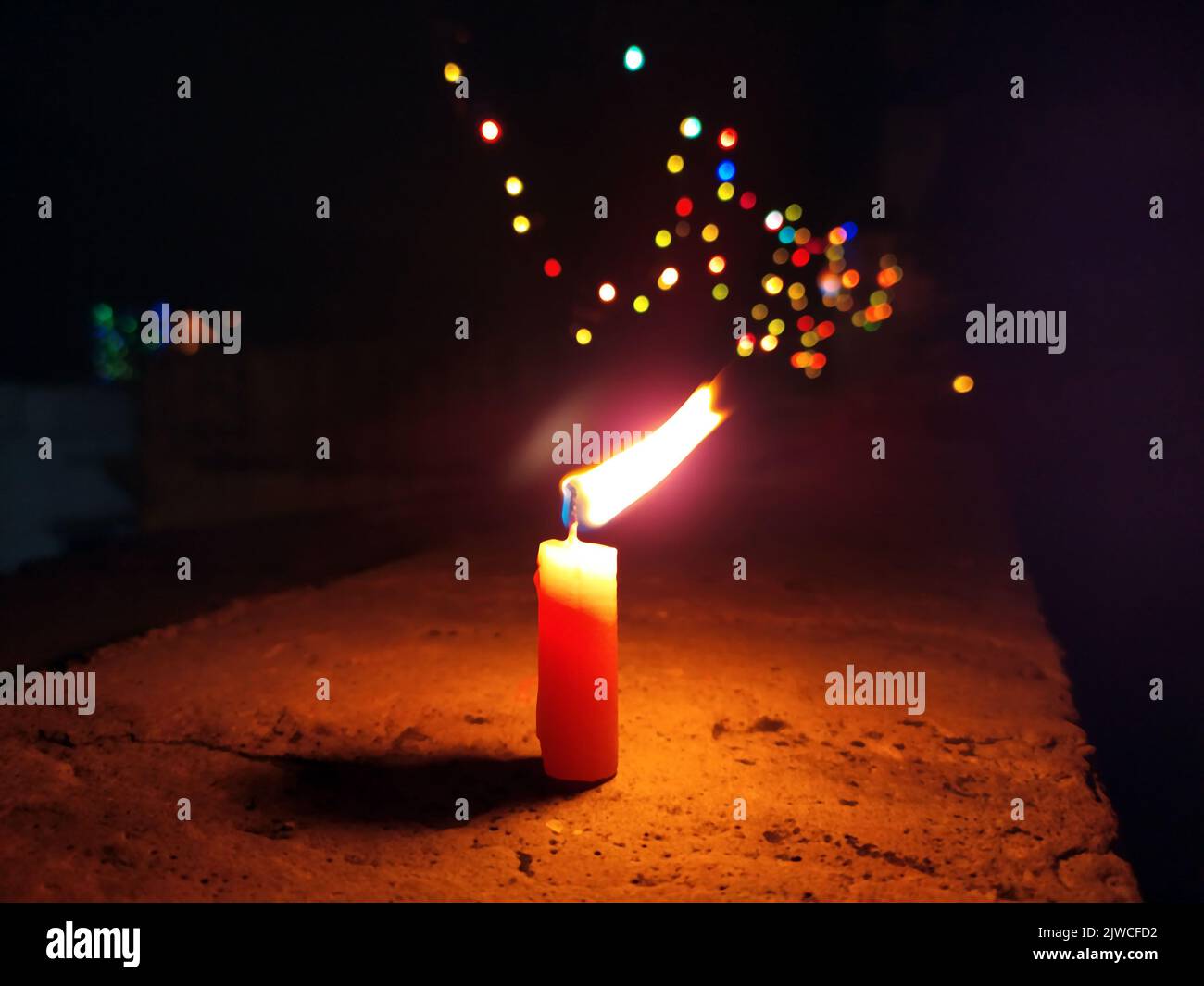 a candal flame is lightning in very dark night Stock Photo