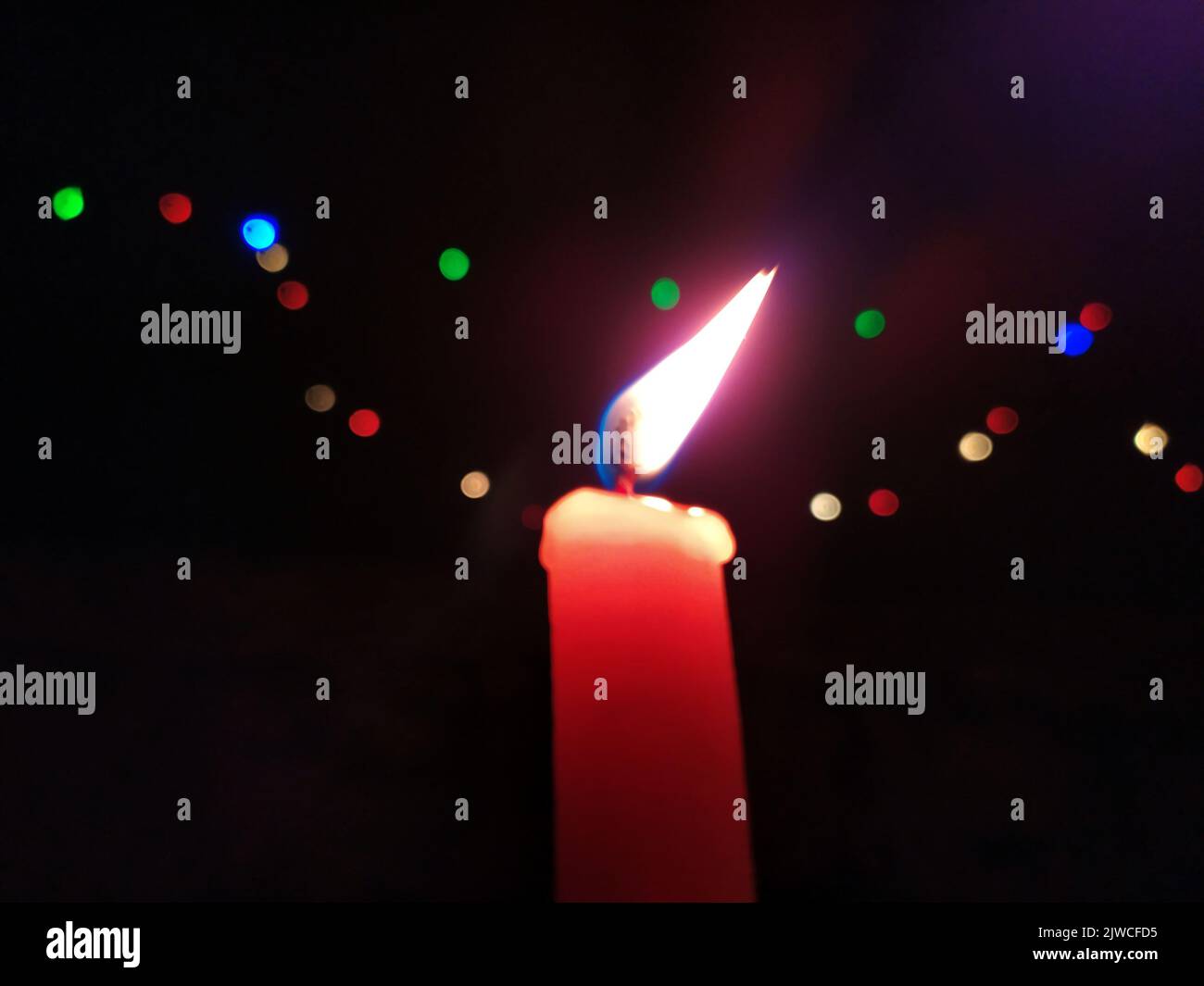 a candal flame is lightning in very dark night Stock Photo
