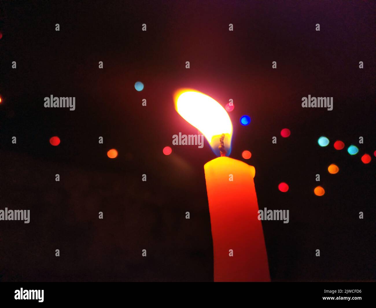 a candal flame is lightning in very dark night Stock Photo