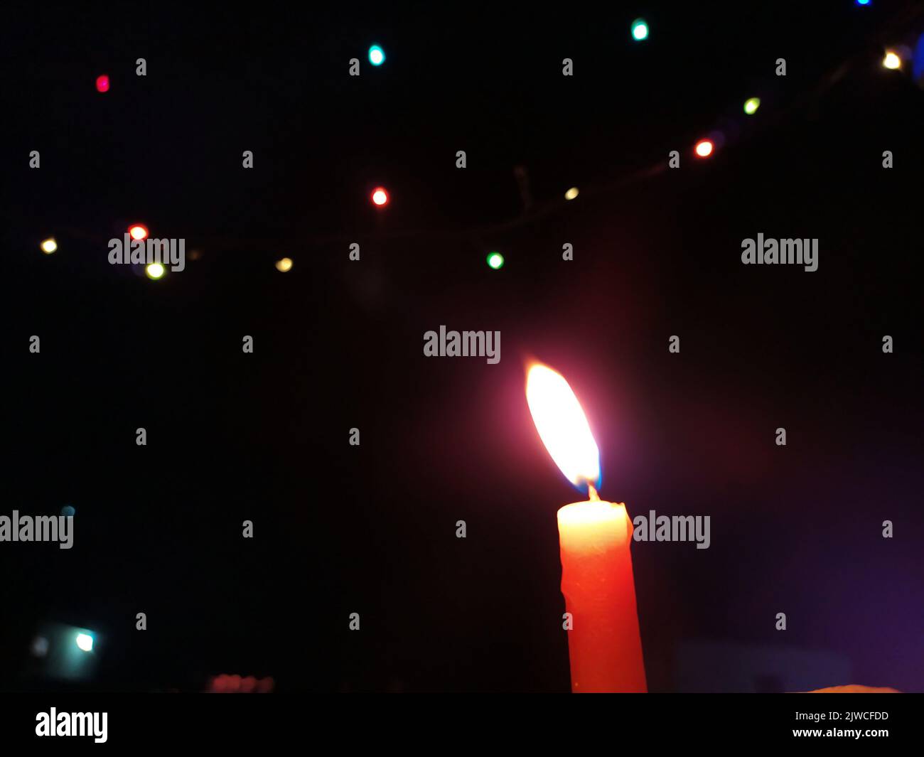 a candal flame is lightning in very dark night Stock Photo