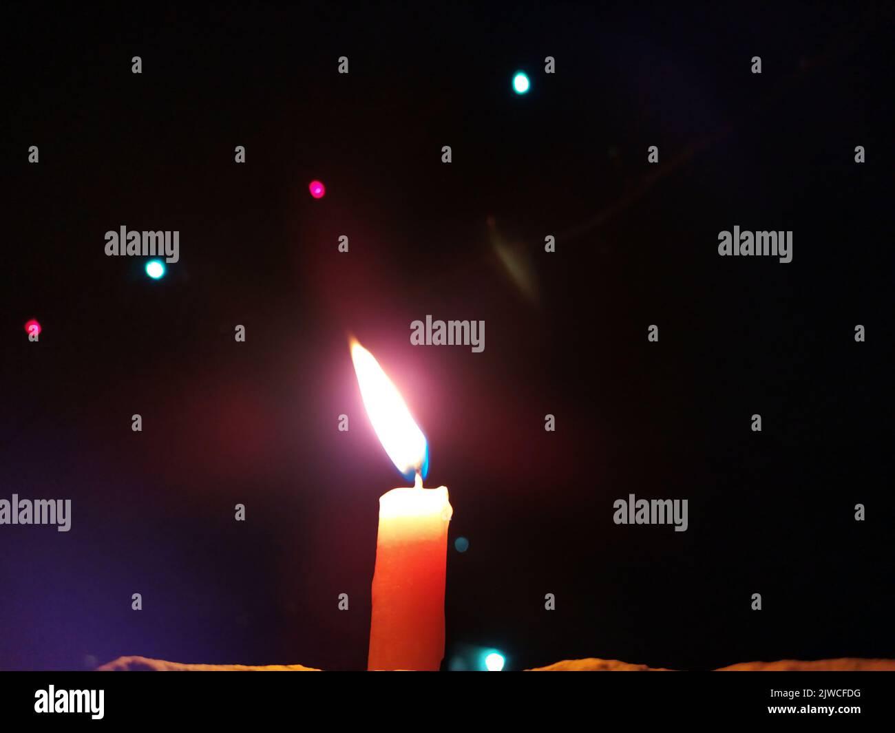 a candal flame is lightning in very dark night Stock Photo
