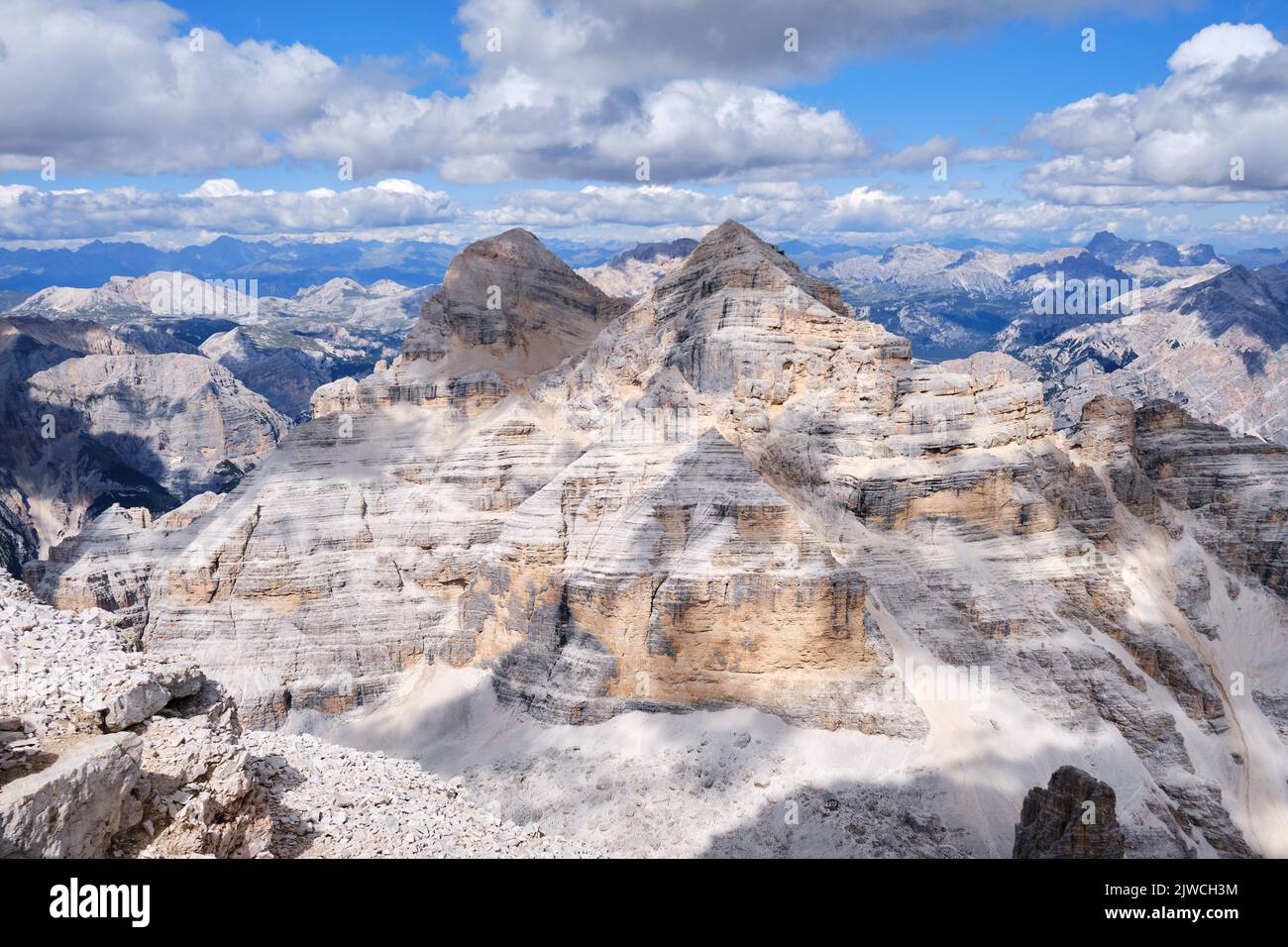 Tofana di Mezzo and di Dentro peaks in Dolomites mountains, Italy, with cloud shadows on a bright Summer day. Alps, summit, activity,hiking. Stock Photo