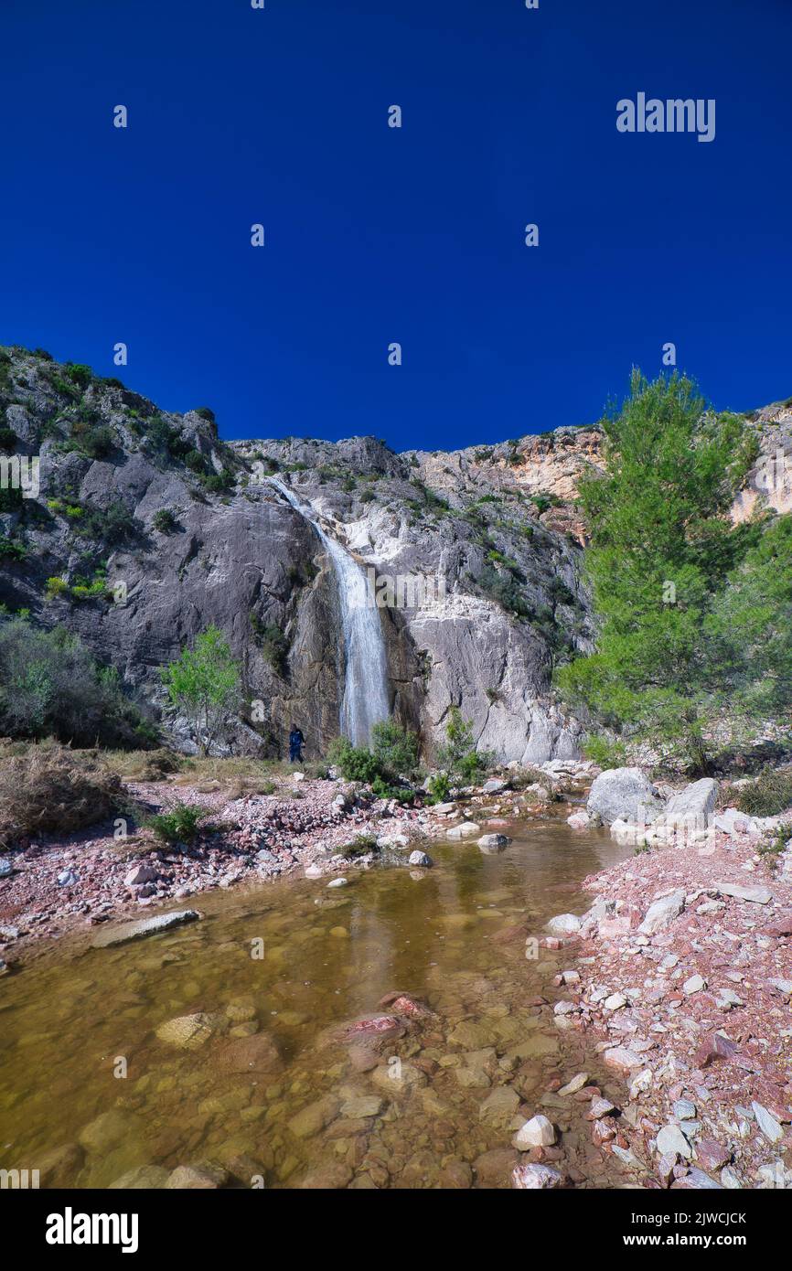 Shallow Waterfall And Rocks A splendid vertical view of a waterfall falling into a shallow stream ...