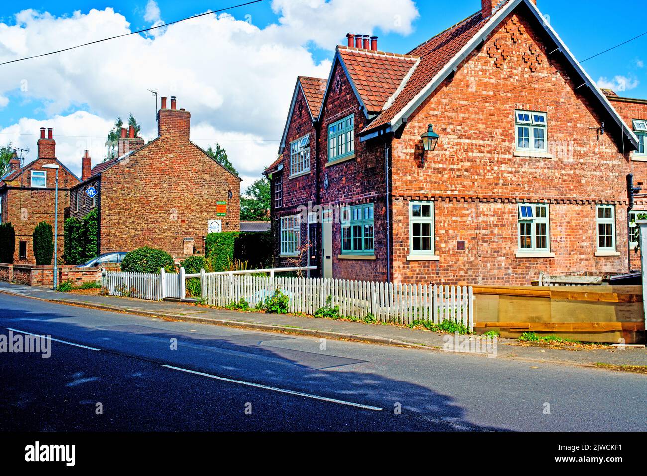 Period Houses with vintage signs, Riccall, North Yorkshire, England Stock Photo
