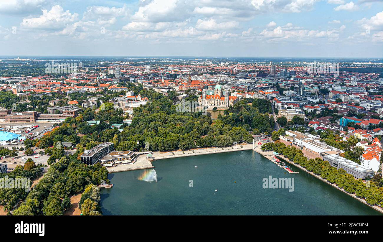 New Town Hall (Neues Rathaus) and Hannover city center aerial view, Germany, Europe. Aircraft point of view aerial shot ft. Maschsee Lake and parks Stock Photo