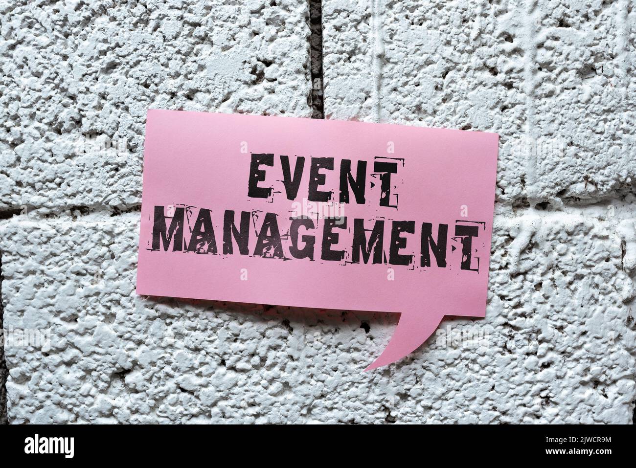 Sign displaying Event Managementcreation and development of large scale