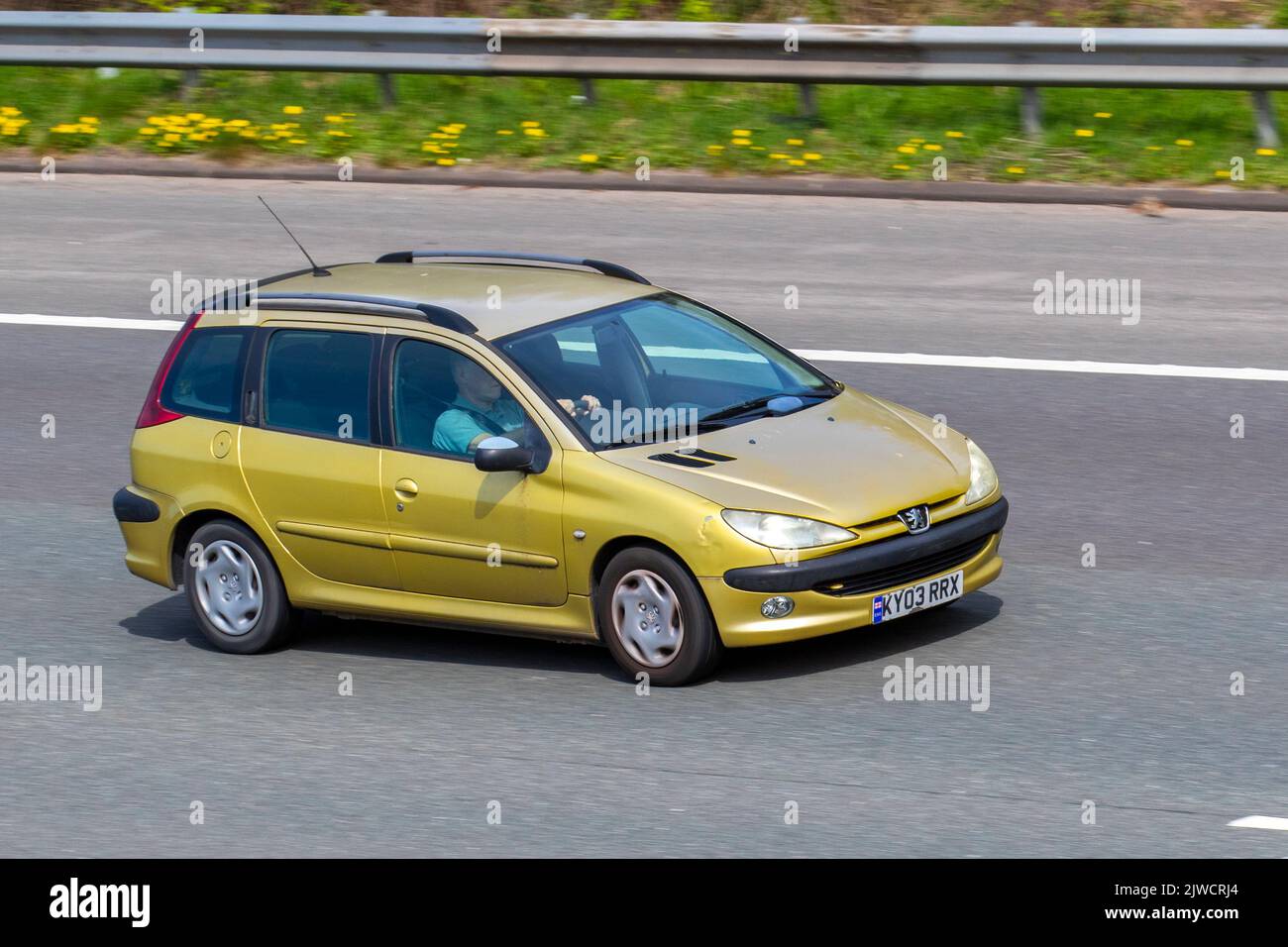 2003 yellow PEUGEOT 206 RAPIER HDI 1997cc 5 speed manual; travelling at speed on the M6 motorway in Greater Manchester, UK Stock Photo