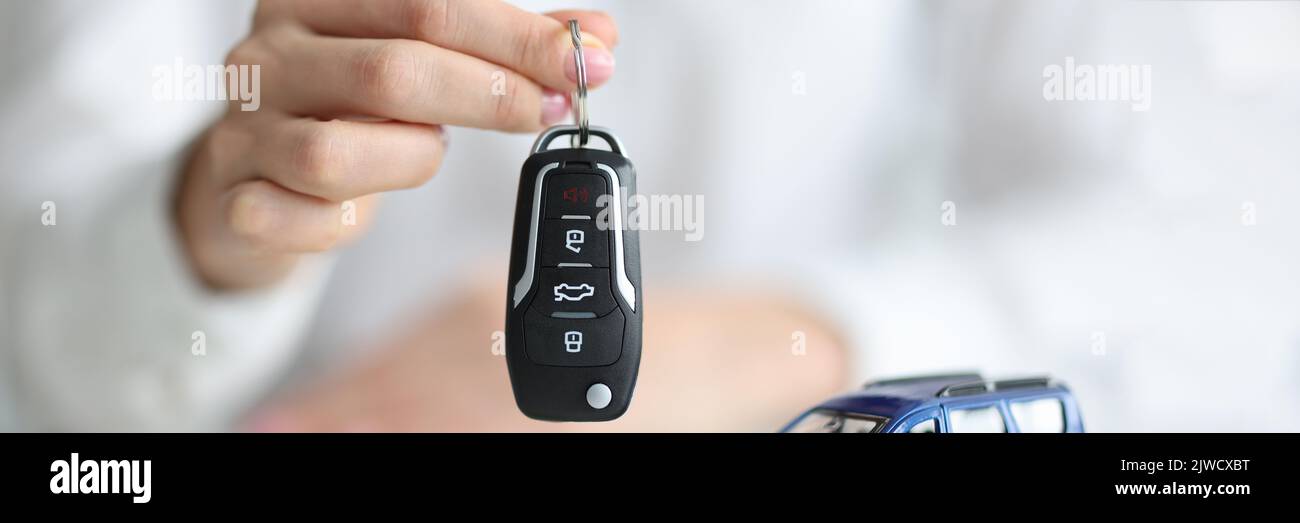 Dealer agent holding keys toy hi-res stock photography and images - Alamy