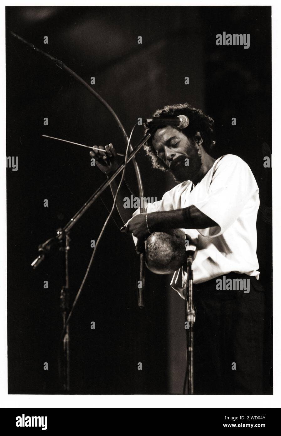 The late Brazilian percussionist Nana Vasconcelos playing the berimbau in concert in New York in 1983. Stock Photo