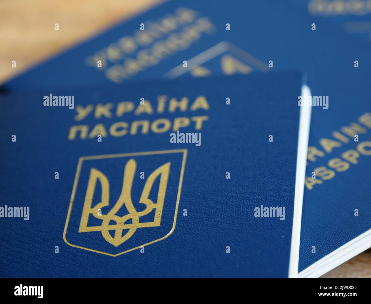 Ukrainian biometric passport id to travel the Europe without visas on the table. Inscription in Ukrainian 'Ukraine Passport' Stock Photo