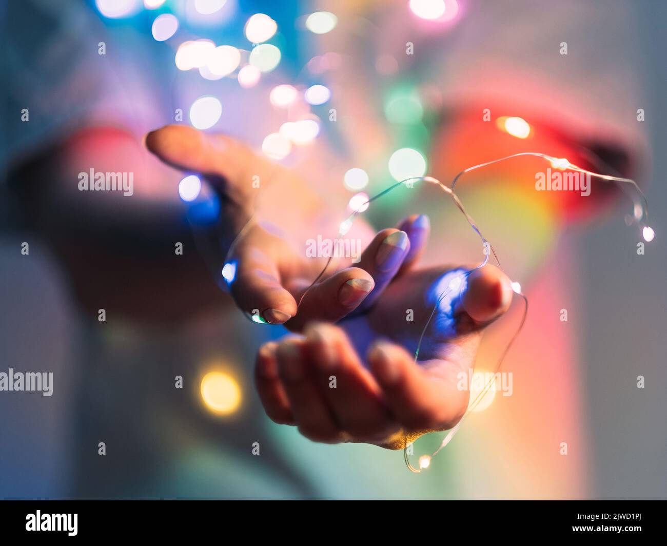 christmas bokeh lights party decoration hands Stock Photo