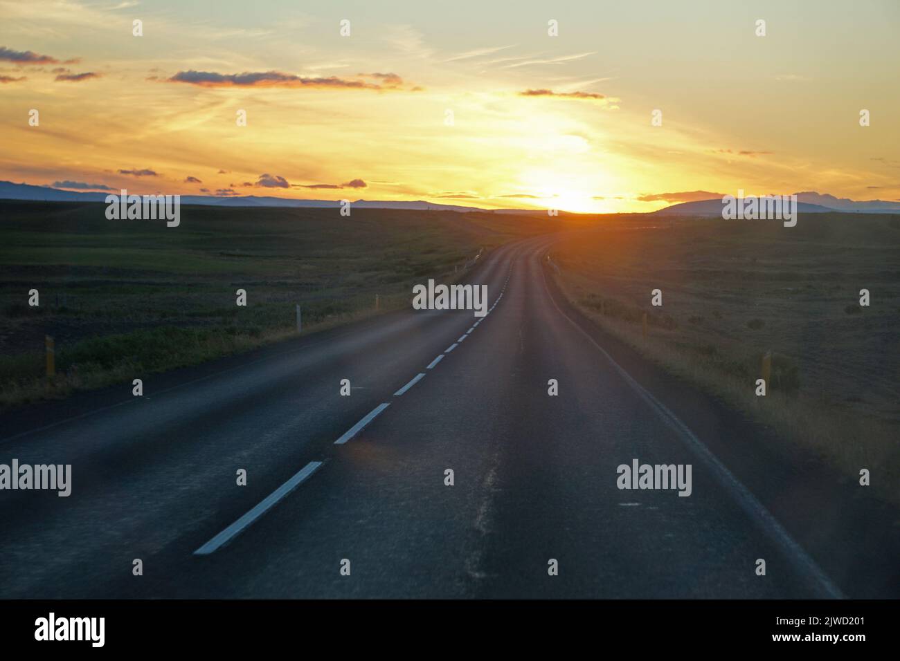 Driving a car in Iceland, sunset sky Stock Photo Alamy