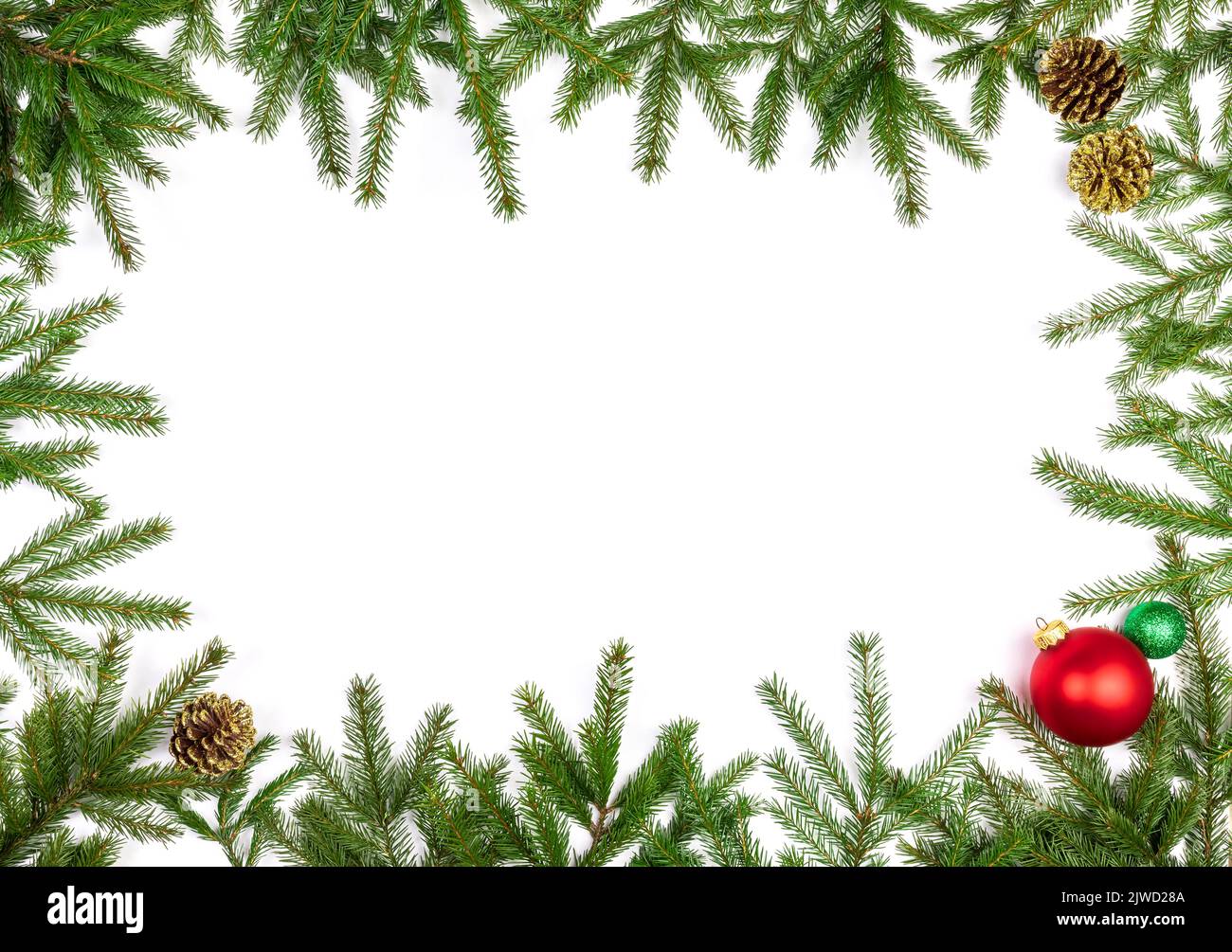 Christmas frame made of fir branches with baubles and cones on white ...