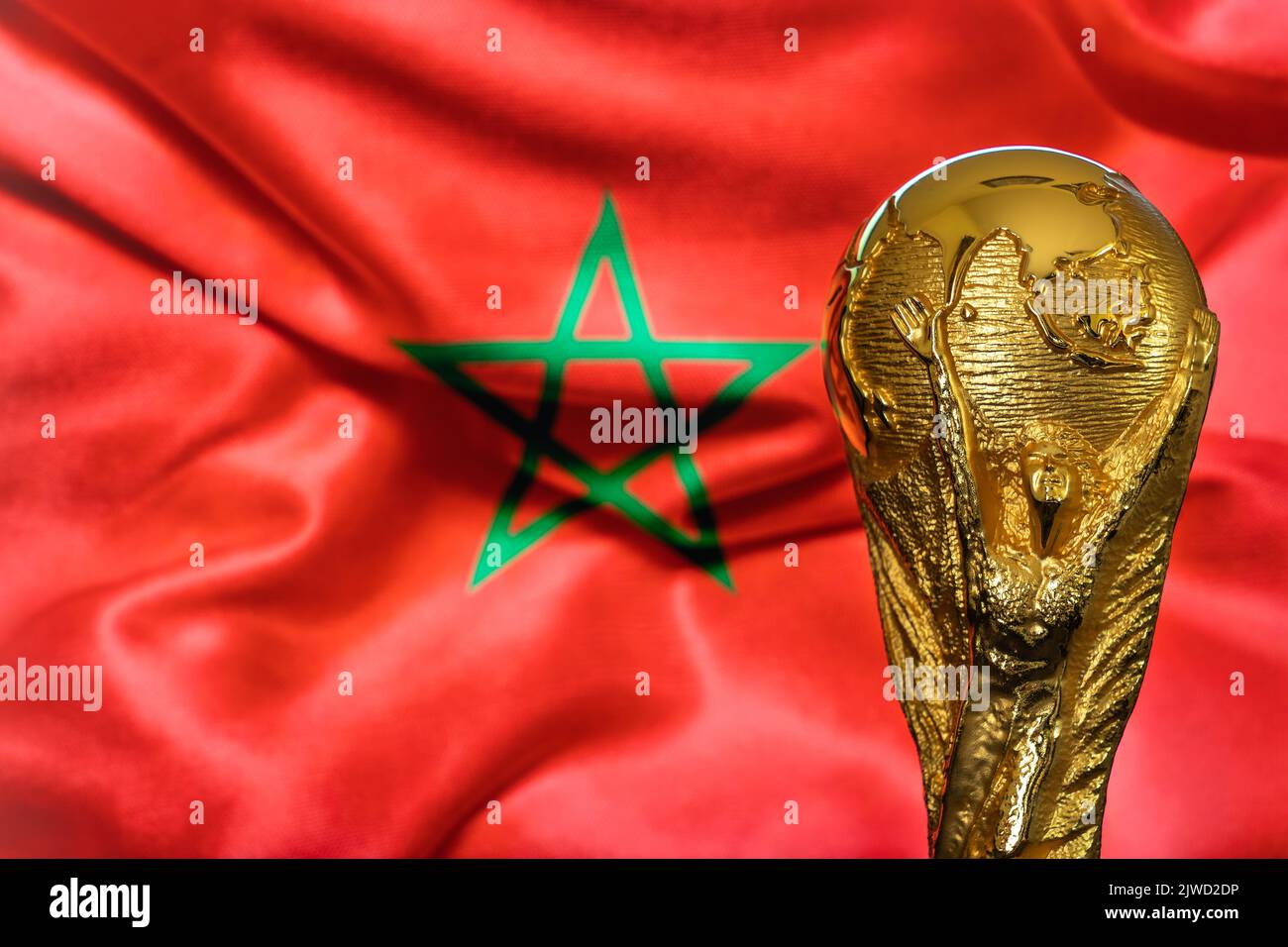 Doha, Qatar - September 4, 2022: FIFA World Cup trophy against the background of Morocco flag. Stock Photo