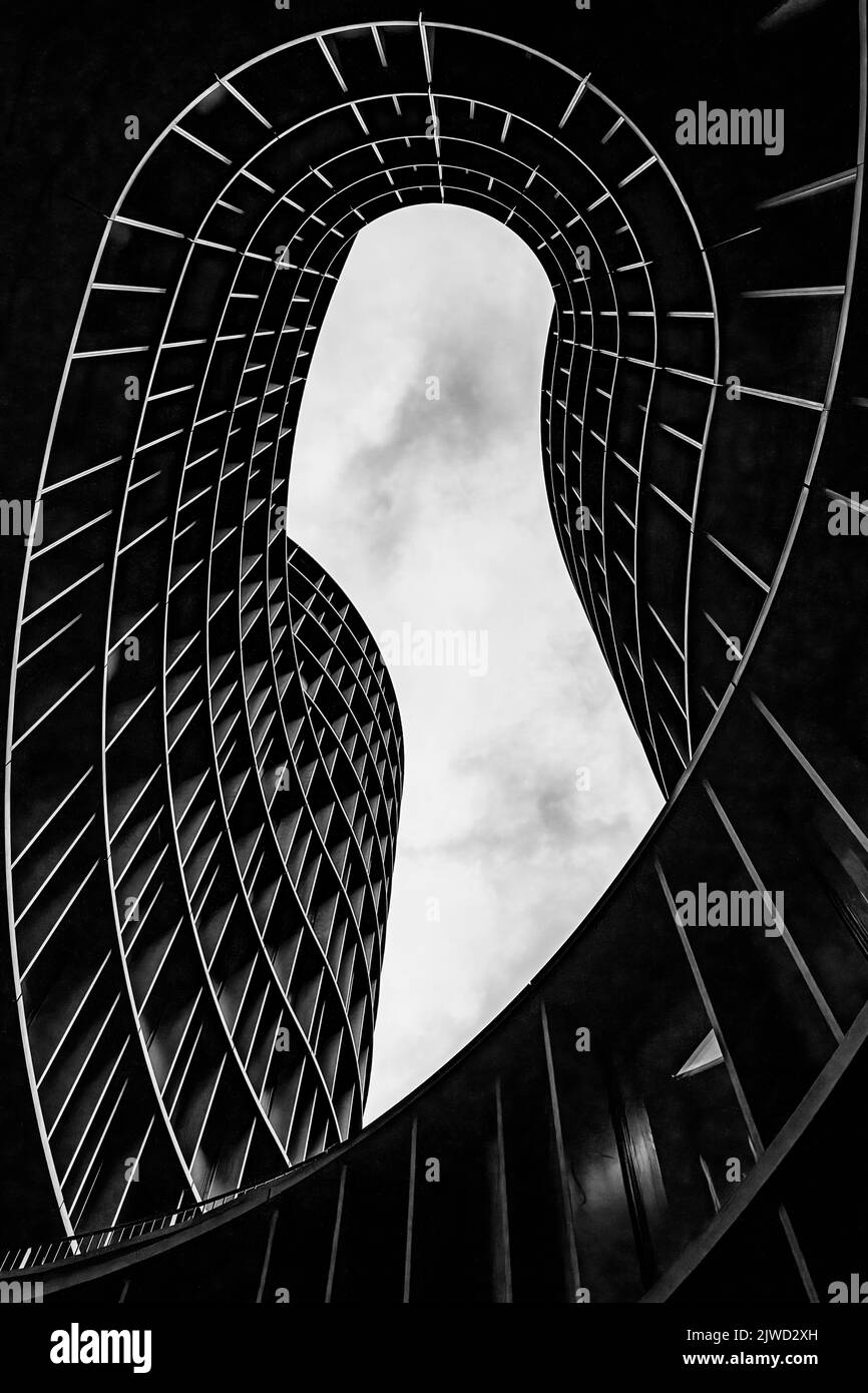 COPENHAGEN, DENMARK - SEPTEMBER 03, 2022: A black and white fine art photograph of Axel Towers which is a modern building consisting of five round tow Stock Photo