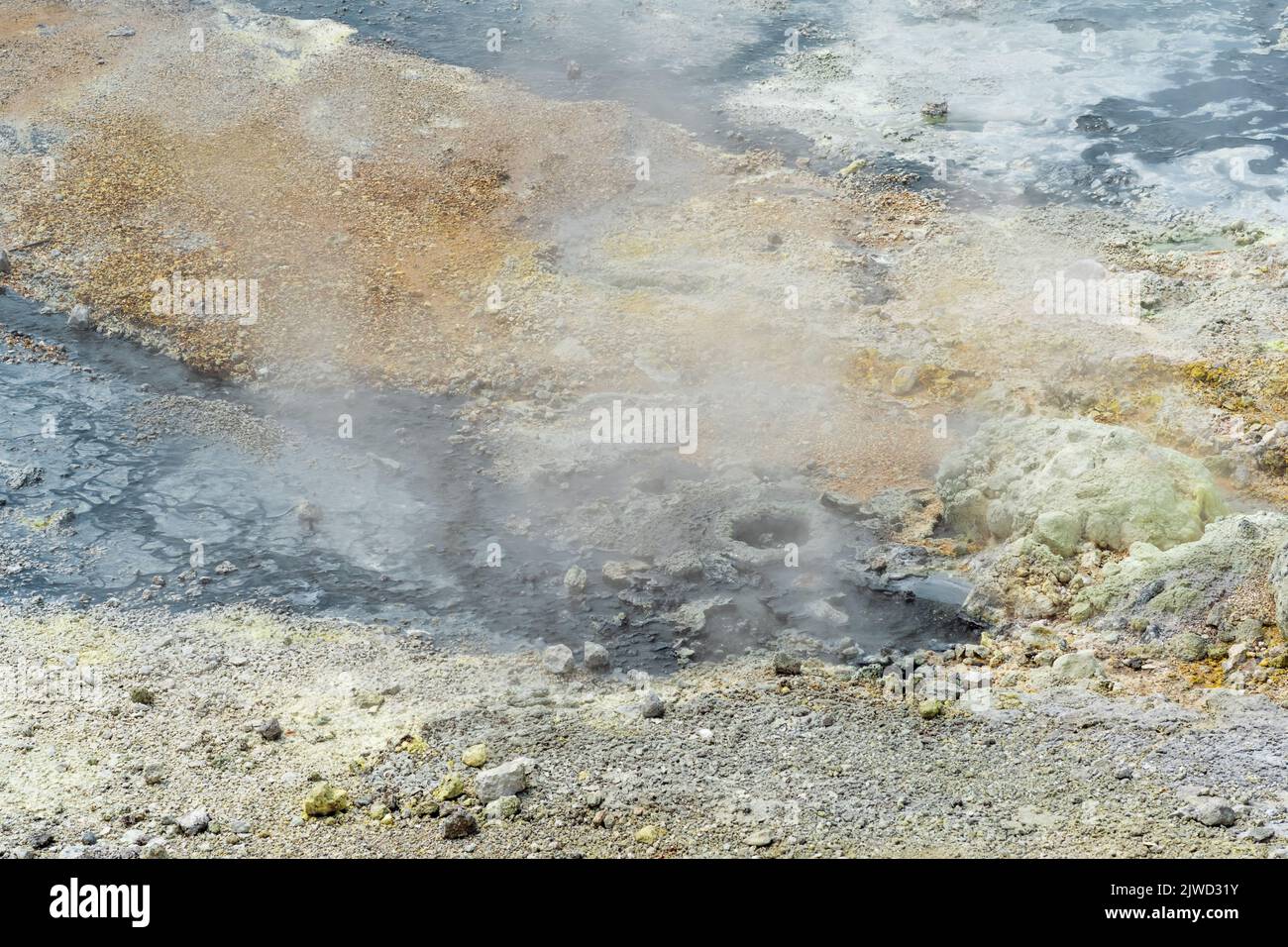 hydrothermal outlet on the shore of the hot lake in the caldera of the Golovnin volcano on the island of Kunashir Stock Photo