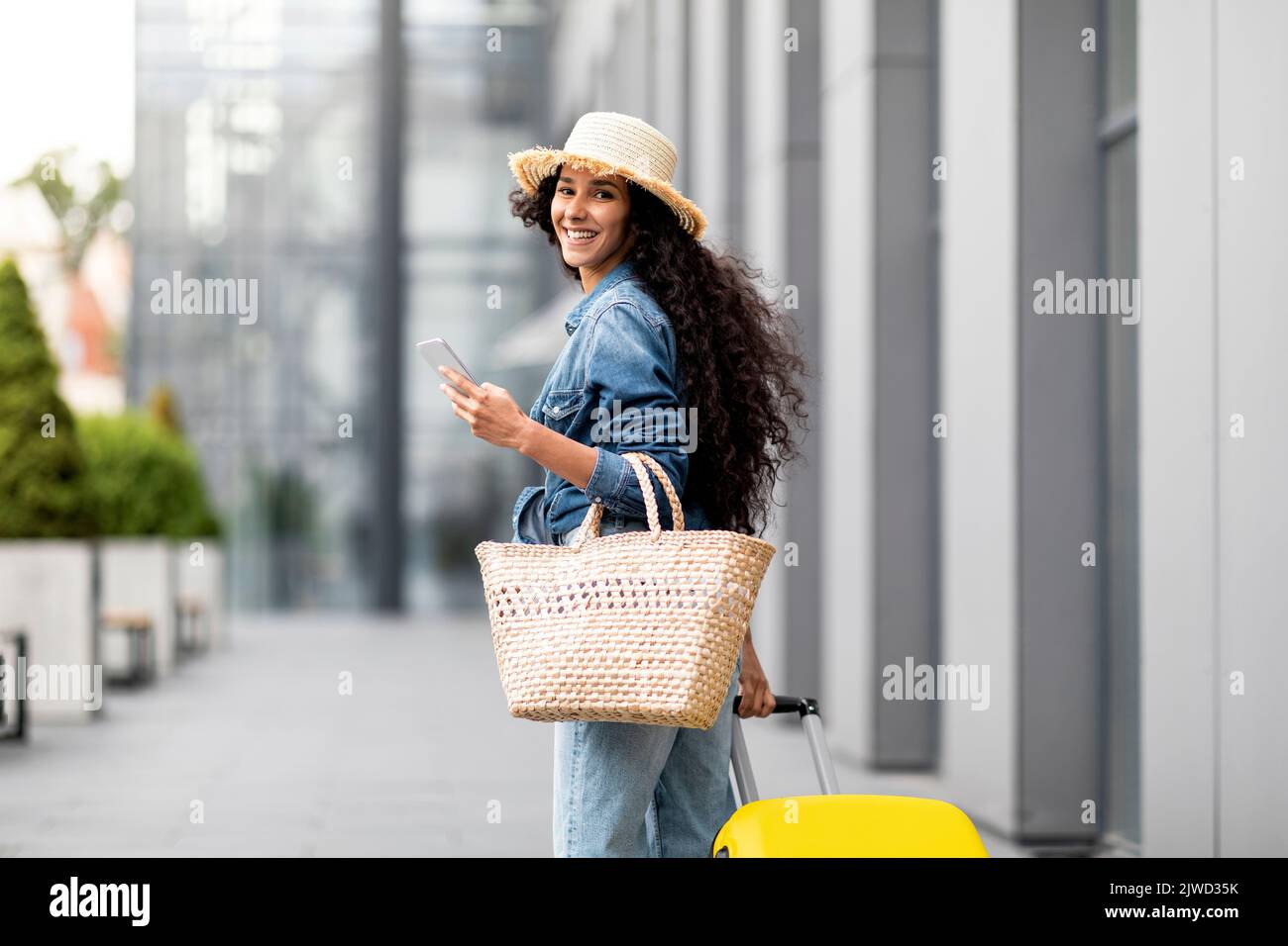Back view happy young tourist hi-res stock photography and images - Alamy