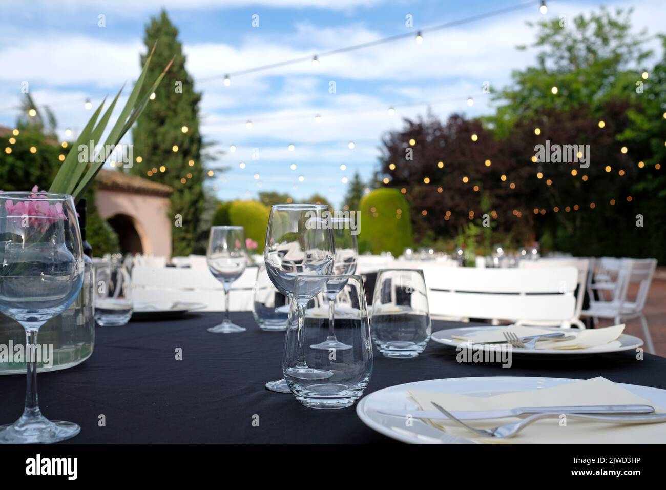 Outdoor venue with dinner tables before event Stock Photo