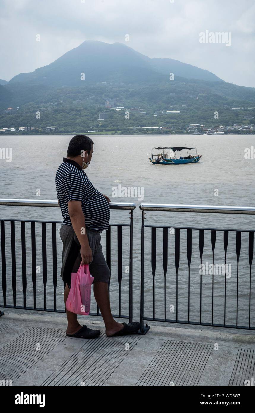 Taipei. 05th Sep, 2022. Man looks on first fishing boat departing in the fishing port affected by Ninnamnor typhoon in Tamsui, Taiwan on 05/09/2022 by Wiktor Dabkowski Credit: dpa/Alamy Live News Stock Photo
