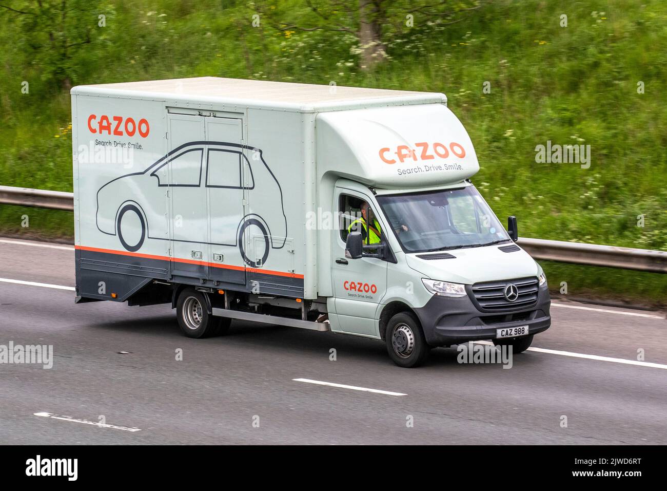CAZOO car haulage. Mercedes Benz Sprinter 516 Cdi van; travelling on the M6 motorway, UK Stock Photo