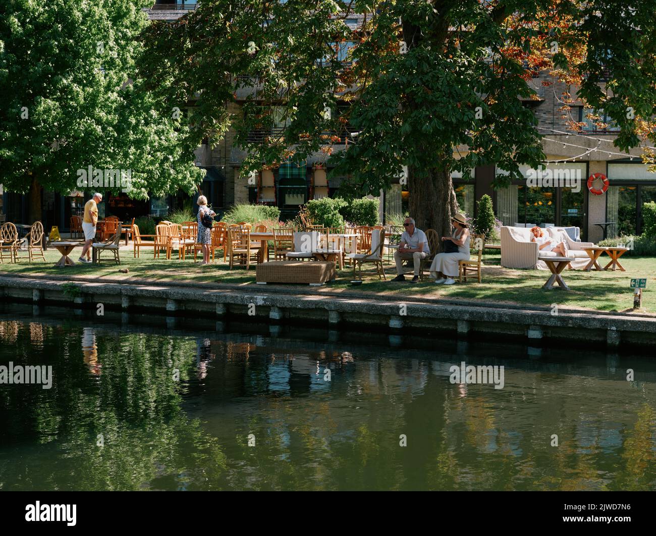 The private guest gardens of the Graduate Cambridge Hotel on the river Cam in summer in Cambridge Cambridgeshire England UK Stock Photo