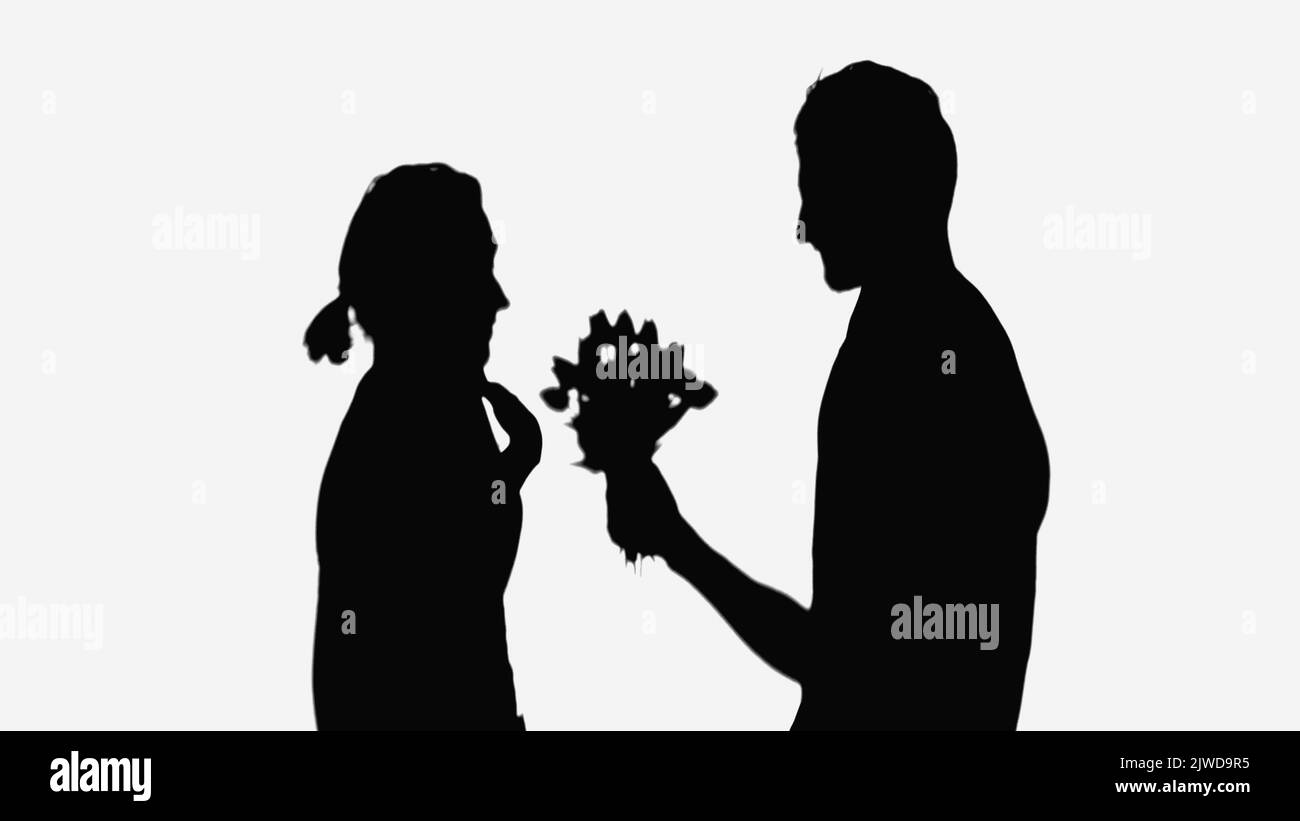 shadows of man with flowers and surprised woman pointing with hand at herself isolated on white Stock Photo