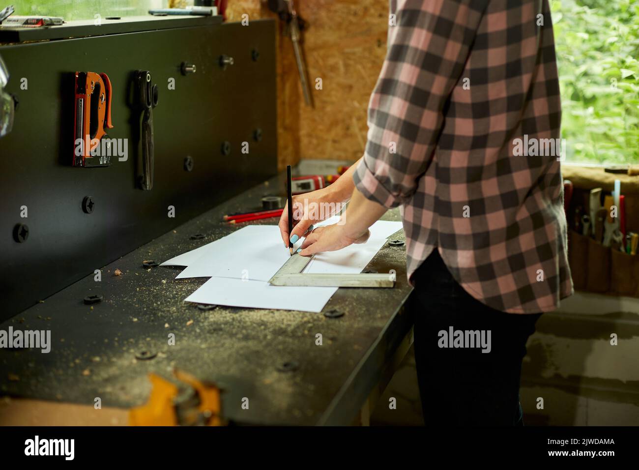 Female interior designer working on drawings, woman architect draws ...