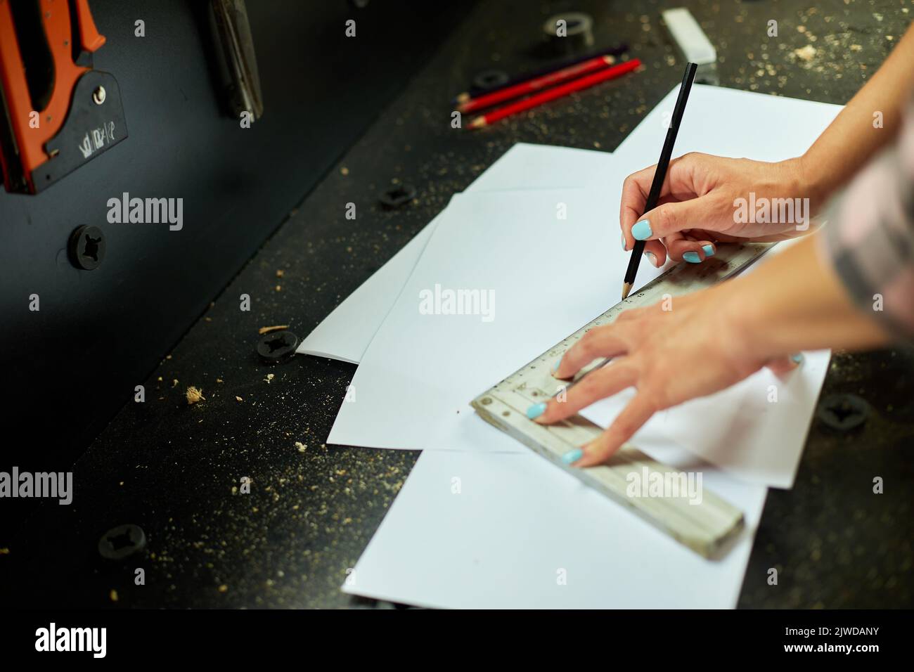 Female interior designer working on drawings, woman architect draws ...