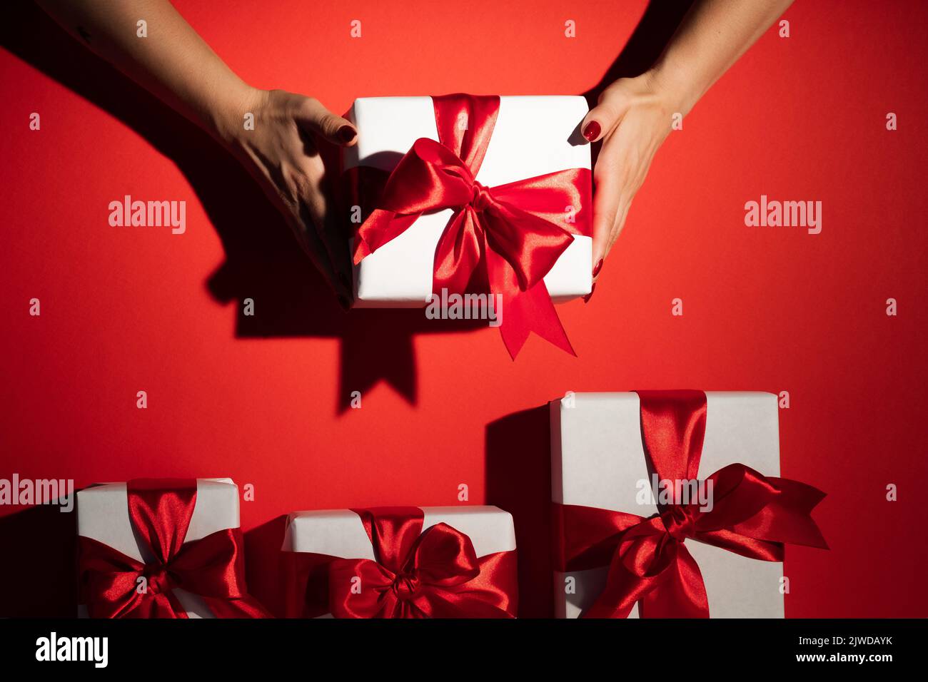 christmas gift holiday surprise hands present red Stock Photo