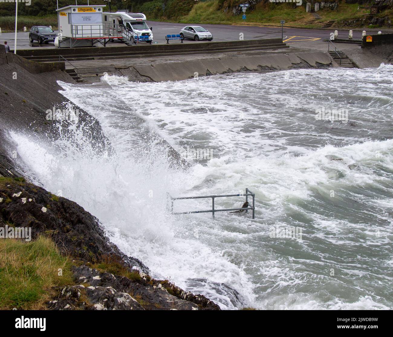 Autumn storm waves breaking on Sea Defence wall, Tragumna, West Cork, Ireland Stock Photo
